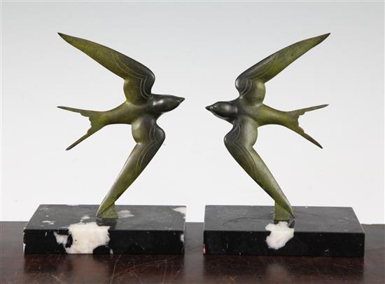 A pair of French patinated bronze swallow bookends, 7in.